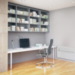 Side view of workpkace with laptop in interior with bookshelves, wooden floor and concrete walls. Modern office concept. 3D Rendering